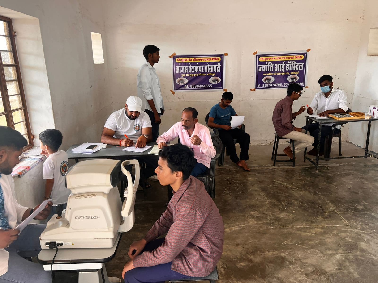 Children reading educational materials at OJASH WELFARE Society